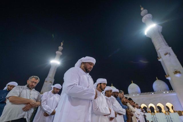 Muslims pray at the Sheikh Zayed Grand Mosque in Abu Dhabi in the early hours of March 16, 2026, on Laylat al-Qadr (Night of Destiny), one of the holiest nights during the Muslim fasting month of Ramadan. (Photo by Ryan Lim / AFP)