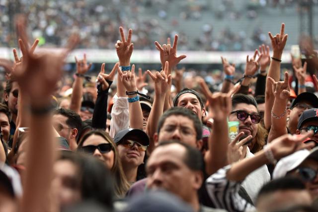 People enjoy the Vive Latino Music Festival at the Hermanos Rodriguez racetrack in Mexico City on March 15, 2026. (Photo by Rodrigo Oropeza / AFP)