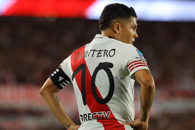 River Plate's Colombian midfielder #10 Juan Fernando Quintero wears a jersey with his name and number made with a special typeface designed by Catalan artist Anna Vives in commemoration of World Down Syndrome Day, which is celebrated on March 31, during the Argentine Professional Football League 2026 Apertura Tournament match between River Plate and Sarmiento at the Mas Monumental Stadium in Buenos Aires on March 15, 2026. (Photo by ALEJANDRO PAGNI / AFP)