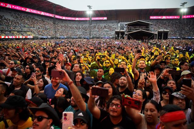 People enjoy the Vive Latino Music Festival at the Hermanos Rodriguez racetrack in Mexico City on March 15, 2026. (Photo by Rodrigo Oropeza / AFP)