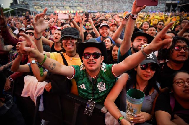 People enjoy the Vive Latino Music Festival at the Hermanos Rodriguez racetrack in Mexico City on March 15, 2026. (Photo by Rodrigo Oropeza / AFP)