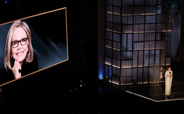 A screen shows a photo of late US actress Diane Keaton as US actress Rachel McAdams speaks during an in memoriam segment at the 98th Annual Academy Awards at the Dolby Theatre in Hollywood, California on March 15, 2026. (Photo by Patrick T. Fallon / AFP)