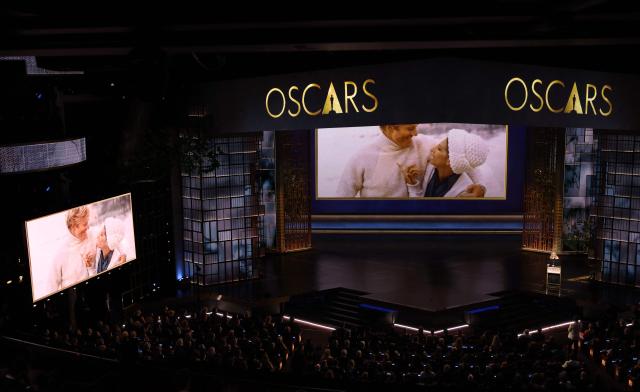 A screen shows late US actor Robert Redford with US singer Barbra Streisand as she speaks during an in memoriam segment onstage during the 98th Annual Academy Awards at the Dolby Theatre in Hollywood, California on March 15, 2026. (Photo by Patrick T. Fallon / AFP)