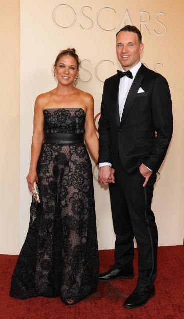 US visual effects supervisor Michael Ralla and a guest  attend the 98th Annual Academy Awards at the Dolby Theatre in Hollywood, California on March 15, 2026. (Photo by ANGELA WEISS / AFP)