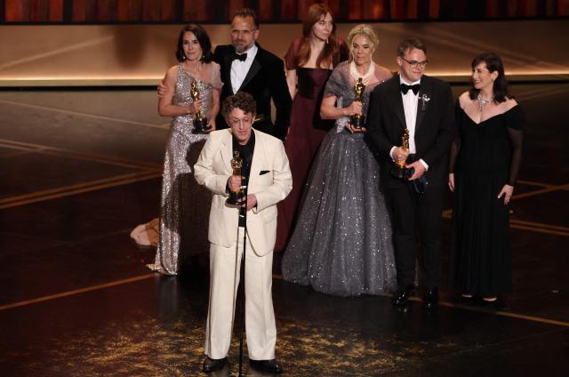 US documentary filmmaker David Borenstein accepts the award for Best Documentary Feature Film for "Mr. Nobody Against Putin", alongside (back row) Alzbeta Karaskova (L), Helle Faber (3R) and Pavel Talankin (2R) onstage during the 98th Annual Academy Awards at the Dolby Theatre in Hollywood, California on March 15, 2026. (Photo by Patrick T. Fallon / AFP)