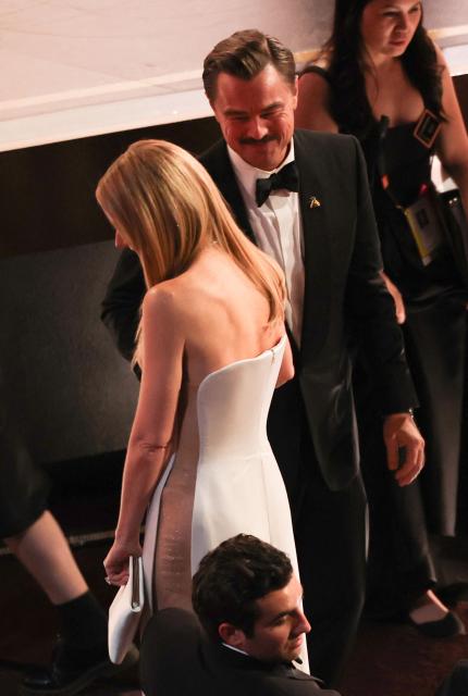 US actor Leonardo DiCaprio and US actress Gwyneth Paltrow speak during the 98th Annual Academy Awards at the Dolby Theatre in Hollywood, California on March 15, 2026. (Photo by Patrick T. Fallon / AFP)
