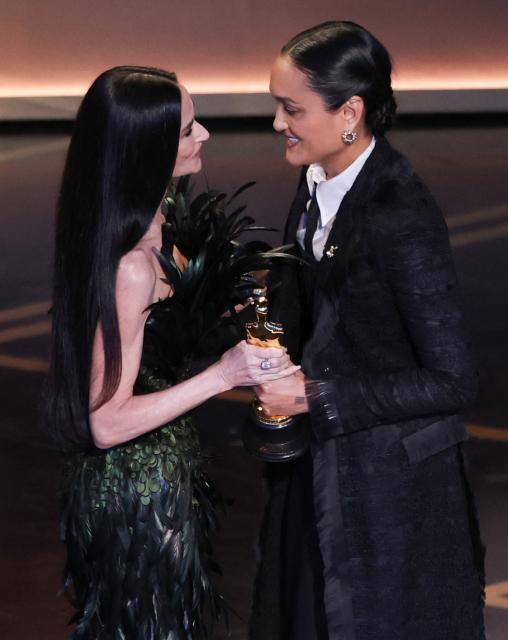 US cinematographer Autumn Durald Arkapaw accepts the award for Best Cinematography for "Sinners" from US actress Demi Moore onstage during the 98th Annual Academy Awards at the Dolby Theatre in Hollywood, California on March 15, 2026. (Photo by Patrick T. Fallon / AFP)