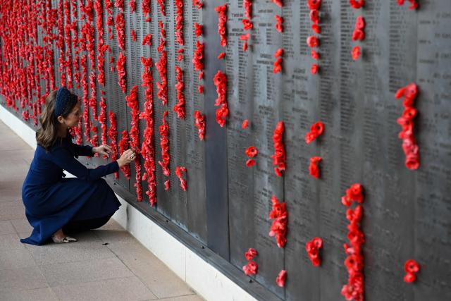 Denmark's Queen Mary places a poppy at the Roll of Honour during a visit to the Australian War Memorial in Canberra on March 16, 2026. (Photo by LUKAS COCH / POOL / AFP)