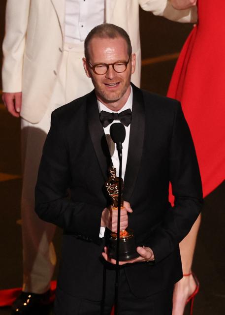 Danish-Norwegian film director and writer Joachim Trier accepts the award for Best International Feature Film for "Sentimental Value" onstage during the 98th Annual Academy Awards at the Dolby Theatre in Hollywood, California on March 15, 2026. (Photo by Patrick T. Fallon / AFP)