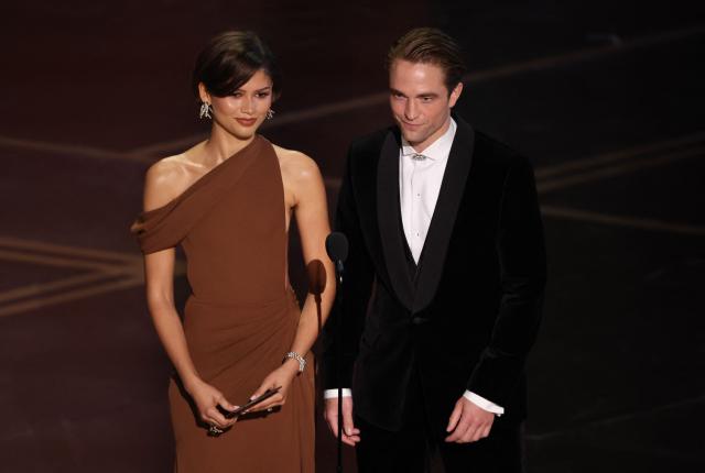 US actress and singer Zendaya and British actor Robert Pattinson present the award for Best Director onstage during the 98th Annual Academy Awards at the Dolby Theatre in Hollywood, California on March 15, 2026. (Photo by Patrick T. Fallon / AFP)