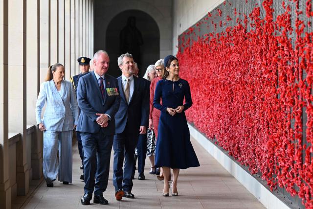 Denmark's King King Frederik X (C) and Queen Mary (R) walk along the Roll of Honour with the Director of the Australian War Memorial Matt Anderson during a visit to the Australian War Memorial in Canberra on March 16, 2026. (Photo by LUKAS COCH / POOL / AFP)