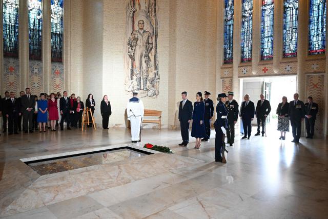 Denmark's King Frederik X and Queen Mary lay a wreath at the Tomb of the Unknown Soldier during a visit to the Australian War Memorial in Canberra on March 16, 2026. (Photo by LUKAS COCH / POOL / AFP)
