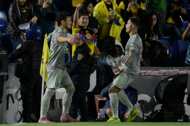 America's Brazilian midfielder #23 Raphael Veiga (L) celebrates with teammate Uruguayan midfielder #07 Brian Rodriguez scoring the opening goal during the Liga MX Clausura match between America and Mazatlan at Ciudad de los Deportes Stadium in Mexico City on March 15, 2026. (Photo by Alfredo ESTRELLA / AFP)