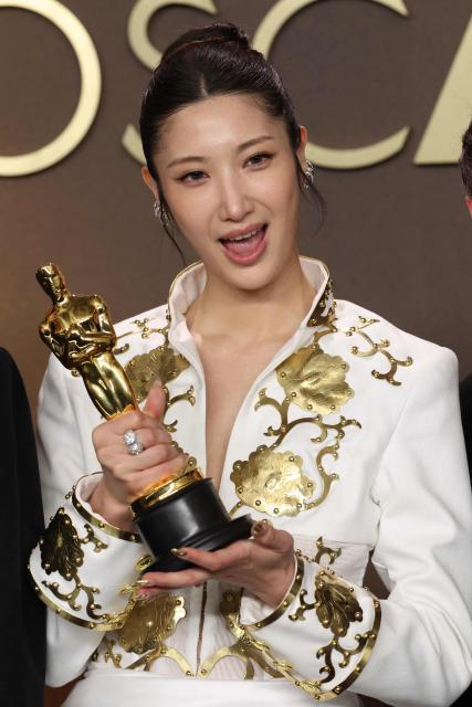 South Korean-US singer Ejae poses in the press room with the Oscar for Best Music (Original Song) for "Golden" from "KPop Demon Hunters" during the 98th Annual Academy Awards at the Dolby Theatre in Hollywood, California on March 15, 2026. (Photo by VALERIE MACON / AFP)