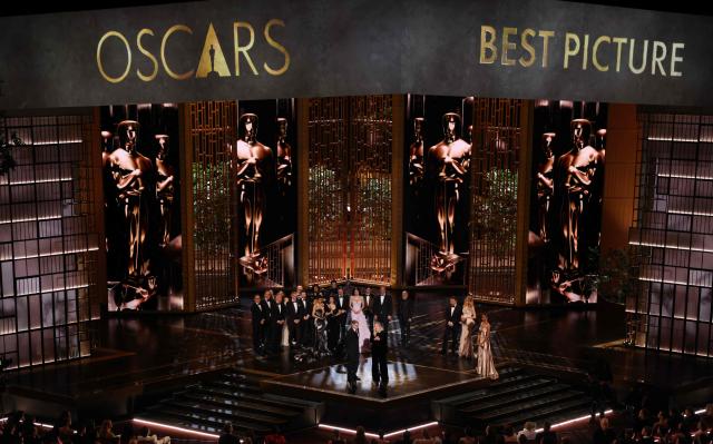 US filmmaker Paul Thomas Anderson and US producer Sara Murphy accept the award for Best Picture for "One Battle After Another" alongside cast and crew onstage during the 98th Annual Academy Awards at the Dolby Theatre in Hollywood, California on March 15, 2026. (Photo by Patrick T. Fallon / AFP)