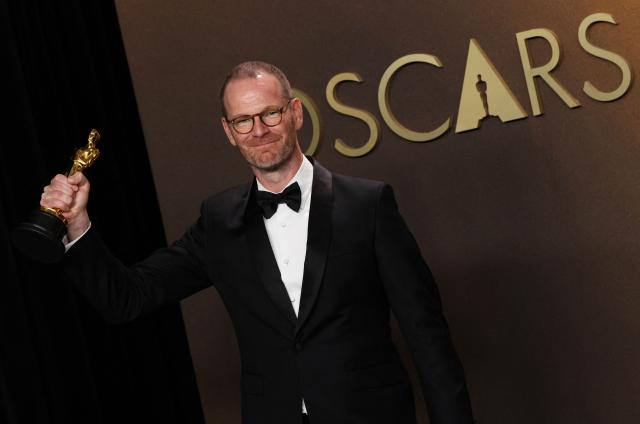 Danish-Norwegian film director and writer Joachim Trier poses in the press room with the Oscar for Best International Feature Film for "Sentimental Value" during the 98th Annual Academy Awards at the Dolby Theatre in Hollywood, California on March 15, 2026. (Photo by VALERIE MACON / AFP)