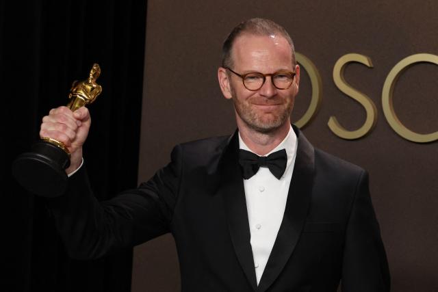 Danish-Norwegian film director and writer Joachim Trier poses in the press room with the Oscar for Best International Feature Film for "Sentimental Value" during the 98th Annual Academy Awards at the Dolby Theatre in Hollywood, California on March 15, 2026. (Photo by VALERIE MACON / AFP)