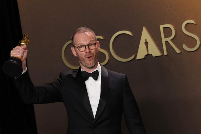 Danish-Norwegian film director and writer Joachim Trier poses in the press room with the Oscar for Best International Feature Film for "Sentimental Value" during the 98th Annual Academy Awards at the Dolby Theatre in Hollywood, California on March 15, 2026. (Photo by VALERIE MACON / AFP)