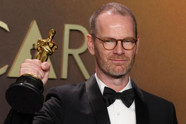 Danish-Norwegian film director and writer Joachim Trier poses in the press room with the Oscar for Best International Feature Film for "Sentimental Value" during the 98th Annual Academy Awards at the Dolby Theatre in Hollywood, California on March 15, 2026. (Photo by VALERIE MACON / AFP)