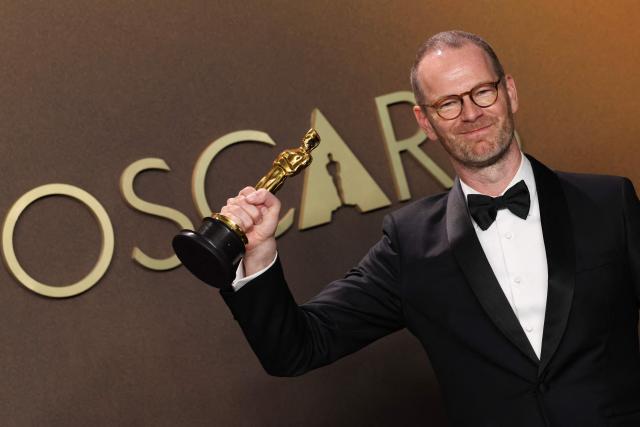 Danish-Norwegian film director and writer Joachim Trier poses in the press room with the Oscar for Best International Feature Film for "Sentimental Value" during the 98th Annual Academy Awards at the Dolby Theatre in Hollywood, California on March 15, 2026. (Photo by VALERIE MACON / AFP)