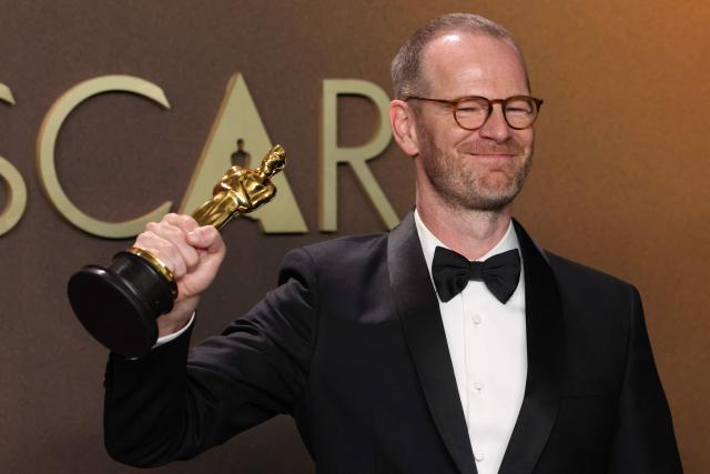 Danish-Norwegian film director and writer Joachim Trier poses in the press room with the Oscar for Best International Feature Film for "Sentimental Value" during the 98th Annual Academy Awards at the Dolby Theatre in Hollywood, California on March 15, 2026. (Photo by VALERIE MACON / AFP)