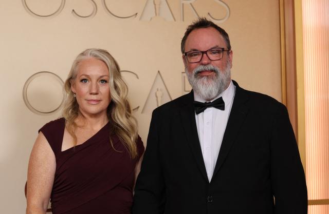 Canadian audio engineer Brad Zoern (R) and guest attend the 98th Annual Academy Awards at the Dolby Theatre in Hollywood, California on March 15, 2026. (Photo by ANGELA WEISS / AFP)