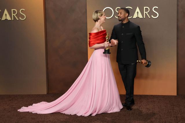 (L/R) Irish actress Jessie Buckley, Oscar winner for Best Actress in a Leading Role for "Hamnet," poses with US actor Michael B. Jordan, Oscar winner for Best Actor in a Leading Role for "Sinners," in the press room during the 98th Annual Academy Awards at the Dolby Theatre in Hollywood, California on March 15, 2026. (Photo by VALERIE MACON / AFP)