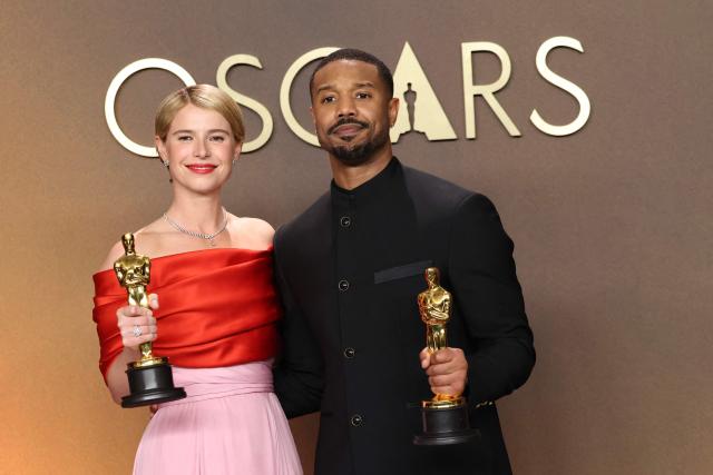 (L/R) Irish actress Jessie Buckley, Oscar winner for Best Actress in a Leading Role for "Hamnet," poses with US actor Michael B. Jordan, Oscar winner for Best Actor in a Leading Role for "Sinners," in the press room during the 98th Annual Academy Awards at the Dolby Theatre in Hollywood, California on March 15, 2026. (Photo by VALERIE MACON / AFP)