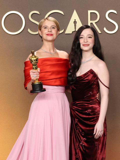 (L/R) Irish actress Jessie Buckley, winner of the Oscar for Best Actress in a Leading Role for "Hamnet," poses with US actress Mikey Madison in the press room during the 98th Annual Academy Awards at the Dolby Theatre in Hollywood, California on March 15, 2026. (Photo by VALERIE MACON / AFP)
