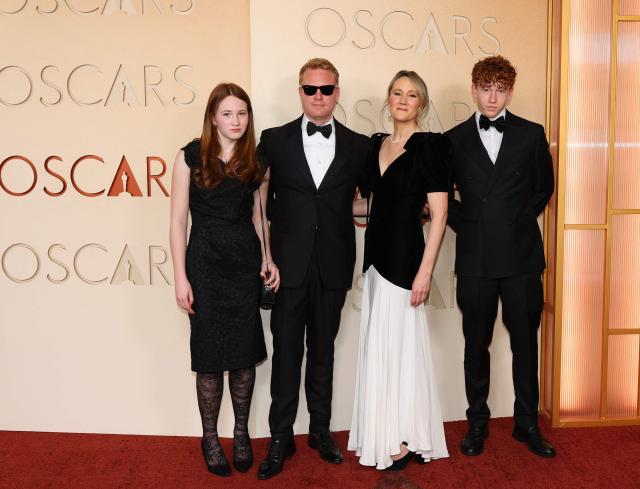 British set decorator Alice Felton (C-R), film producer Adam Ackland (C-L) and guests attend the 98th Annual Academy Awards at the Dolby Theatre in Hollywood, California on March 15, 2026. (Photo by ANGELA WEISS / AFP)