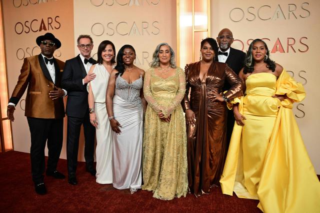 (From L) US producer Nikon Kwantu, US producer Sam Bisbee, Jackie Kelman Bisbee, Pamela Dias, US documentary filmmaker Geeta Gandbhir, Takema Robinson, Sam Pollard and US producer Alisa Payne attend the 98th Annual Academy Awards at the Dolby Theatre in Hollywood, California on March 15, 2026. (Photo by Frederic J. Brown / AFP)
