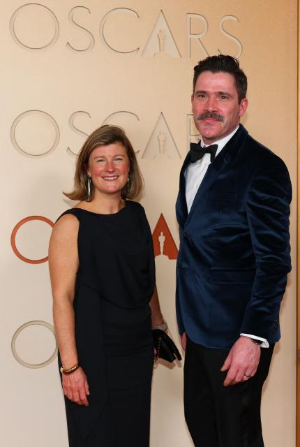 US visual effects supervisor David Vickery (R) and guest attend the 98th Annual Academy Awards at the Dolby Theatre in Hollywood, California on March 15, 2026. (Photo by ANGELA WEISS / AFP)