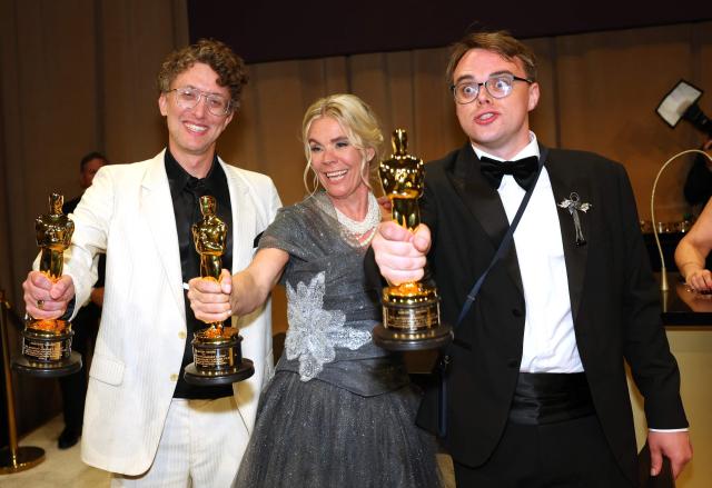 US documentary filmmaker David Borenstein (L), Danish producer Helle Faber (C) and Russian teacher Pavel Talankin (L) hold their award for Best Documentary Feature Film for "Mr. Nobody Against Putin" at the 98th Annual Academy Awards Governors Ball at the Dolby Theatre in Hollywood, California on March 15, 2026. (Photo by ANGELA WEISS / AFP)