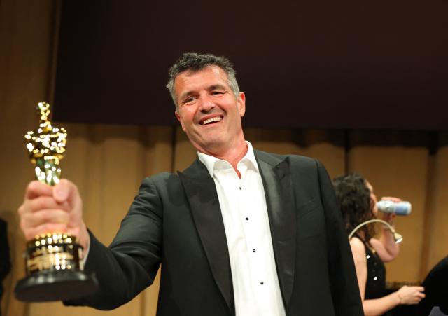 US visual effects supervisor Eric Saindon holds his award for Best Visual Effects for his work on “Avatar: Fire and Ash,”at   the 98th Annual Academy Awards Governors Ball at the Dolby Theatre in Hollywood, California on March 15, 2026. (Photo by ANGELA WEISS / AFP)