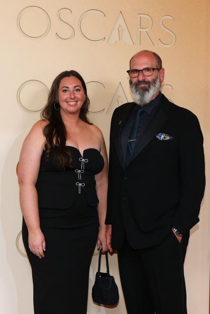 US prosthetic make-up artist Howard Berger (R) and guest attend the 98th Annual Academy Awards at the Dolby Theatre in Hollywood, California on March 15, 2026. (Photo by ANGELA WEISS / AFP)