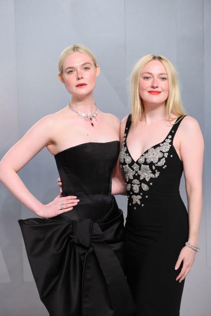 US actress Elle Fanning and US actress Dakota Fanning attends the Vanity Fair Oscar Party at the Los Angeles County Museum of Art (LACMA) in Los Angeles on March 15, 2026. (Photo by Jean Baptiste Lacroix / AFP)