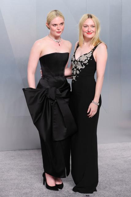 US actress Elle Fanning and US actress Dakota Fanning attends the Vanity Fair Oscar Party at the Los Angeles County Museum of Art (LACMA) in Los Angeles on March 15, 2026. (Photo by Jean Baptiste Lacroix / AFP)