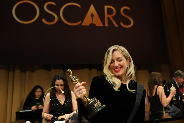 US producer Sara Murphy holds her Oscar for Best Picture for "One Battle After Another" as she attends the 98th Annual Academy Awards Governors Ball at the Dolby Theatre in Hollywood, California on March 15, 2026. (Photo by ANGELA WEISS / AFP)