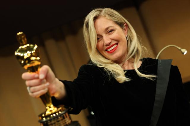 US producer Sara Murphy holds her Oscar for Best Picture for "One Battle After Another" as she attends the 98th Annual Academy Awards Governors Ball at the Dolby Theatre in Hollywood, California on March 15, 2026. (Photo by ANGELA WEISS / AFP)