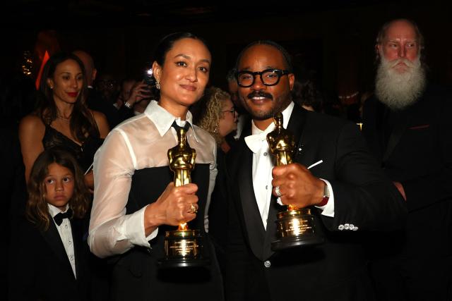 US director Ryan Coogler stands with his Oscar for Best Writing (Original Screenplay) for "Sinners" next to US cinematographer Autumn Durald Arkapaw with her Oscar for Best Cinematography for "Sinners" during the 98th Annual Academy Awards Governors Ball at the Dolby Theatre in Hollywood, California on March 15, 2026. (Photo by ANGELA WEISS / AFP)