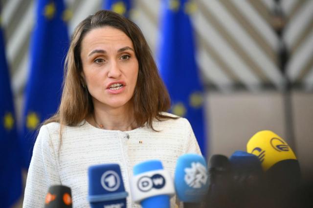 Romania's Foreign Minister Oana-Silvia Toiu speaks to the media as she arrives for a Foreign Affairs Council to discuss Russia’s war of aggression against Ukraine and the situation in the Middle East, in Brussels on March 16, 2026. (Photo by NICOLAS TUCAT / AFP)