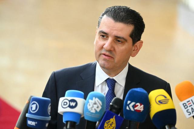 Cyprus' Minister of Energy, Commerce and Industry, Michael Damianos speaks to the media as he arrives for a Transport, Telecommunications and Energy Council in Brussels on March 16, 2026. (Photo by NICOLAS TUCAT / AFP)