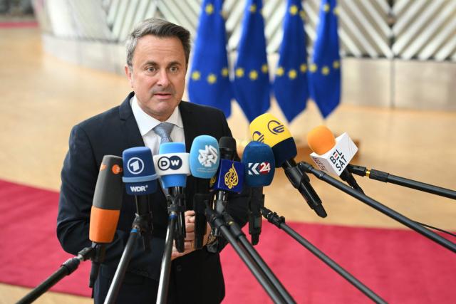 Luxembourg's Foreign Minister Xavier Bettel speaks to the media as he arrives for a Foreign Affairs Council to discuss Russia’s war of aggression against Ukraine and the situation in the Middle East, in Brussels on March 16, 2026. (Photo by NICOLAS TUCAT / AFP)