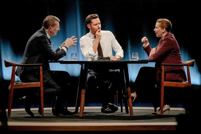 Denmark's Prime Minister and top candidate of the Social Democrat Party, Mette Frederiksen and Denmark's Defense Minister and top candidate of Denmark's Liberal Party Venstre, Troels Lund Poulsen attend the debate "Face to Face - Who should lead Denmark?" hosted by Kaare Quist in DR Byen in Copenhagen, Denmark on March 15, 2026. The Danish parliamentary election will be held on March 24, 2026. (Photo by Mads Claus Rasmussen / Ritzau Scanpix / AFP) / Denmark OUT