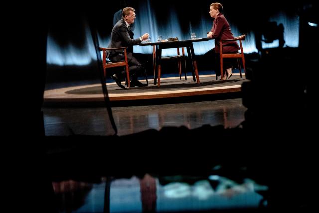 Denmark's Prime Minister and top candidate of the Social Democrat Party, Mette Frederiksen and Denmark's Defense Minister and top candidate of Denmark's Liberal Party Venstre, Troels Lund Poulsen attend the debate "Face to Face - Who should lead Denmark?" hosted by Kaare Quist in DR Byen in Copenhagen, Denmark on March 15, 2026. The Danish parliamentary election will be held on March 24, 2026. (Photo by Mads Claus Rasmussen / Ritzau Scanpix / AFP) / Denmark OUT