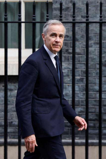 Canada's Prime Minister Mark Carney leaves 10 Downing Street following his talks with the British prime minister in central London on March 16, 2026. (Photo by Brook Mitchell / POOL / AFP)
