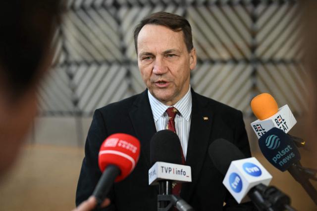 Poland's Foreign Minister Rados?aw Sikorski speaks to the media as he arrives for a Foreign Affairs Council to discuss Russia’s war of aggression against Ukraine and the situation in the Middle East, in Brussels on March 16, 2026. (Photo by NICOLAS TUCAT / AFP)