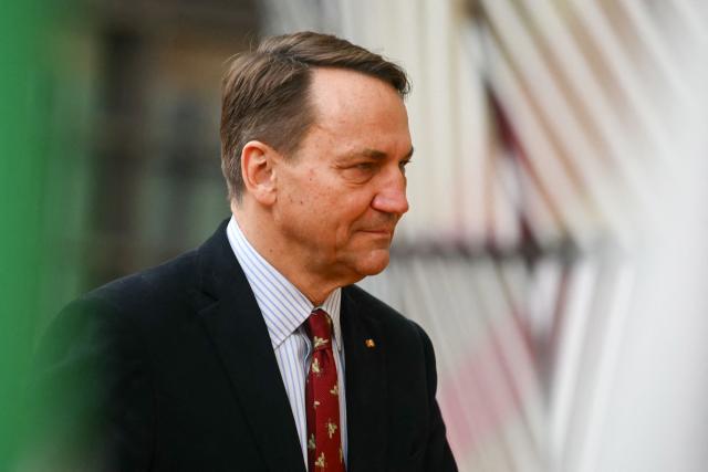Poland's Foreign Minister Rados?aw Sikorski arrives for a Foreign Affairs Council to discuss Russia’s war of aggression against Ukraine and the situation in the Middle East, in Brussels on March 16, 2026. (Photo by NICOLAS TUCAT / AFP)