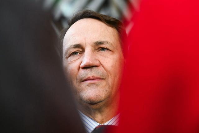 Poland's Foreign Minister Rados?aw Sikorski speaks to the media as he arrives for a Foreign Affairs Council to discuss Russia’s war of aggression against Ukraine and the situation in the Middle East, in Brussels on March 16, 2026. (Photo by NICOLAS TUCAT / AFP)
