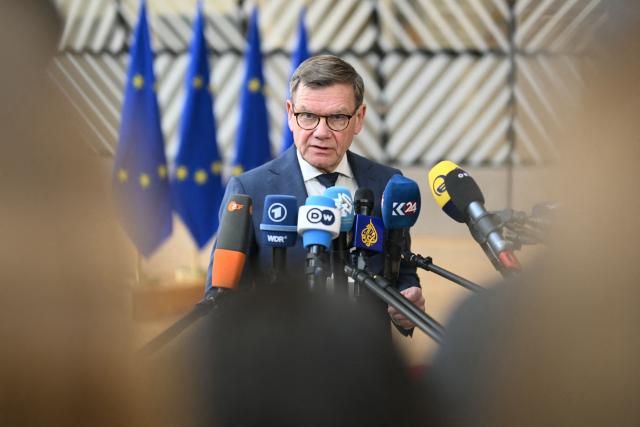 Germany's Foreign Minister Johann Wadephul speaks to the media as he arrives for a Foreign Affairs Council to discuss Russia’s war of aggression against Ukraine and the situation in the Middle East, in Brussels on March 16, 2026. (Photo by NICOLAS TUCAT / AFP)